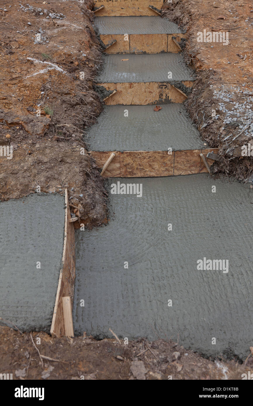 Newly poured concrete setup for house footings Stock Photo Alamy