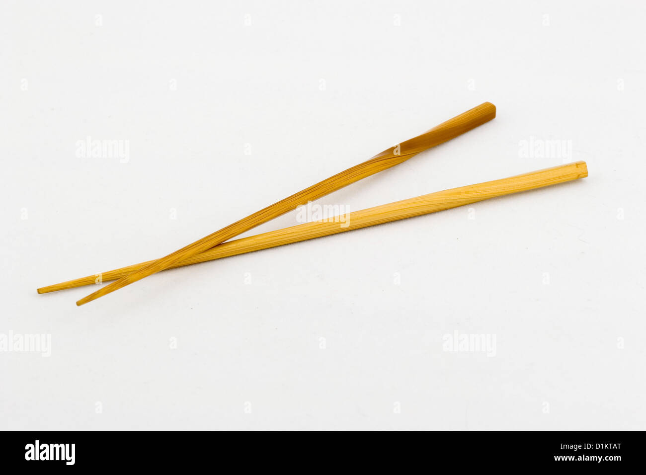 Bamboo chopsticks on a white background. Stock Photo