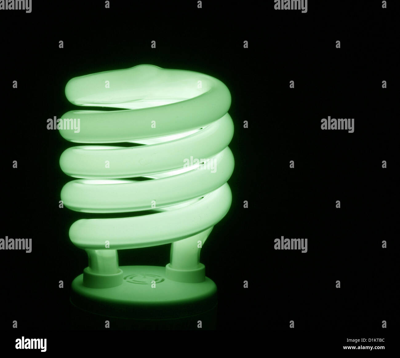 Energy efficient fluorescent light bulb on black background Stock Photo ...