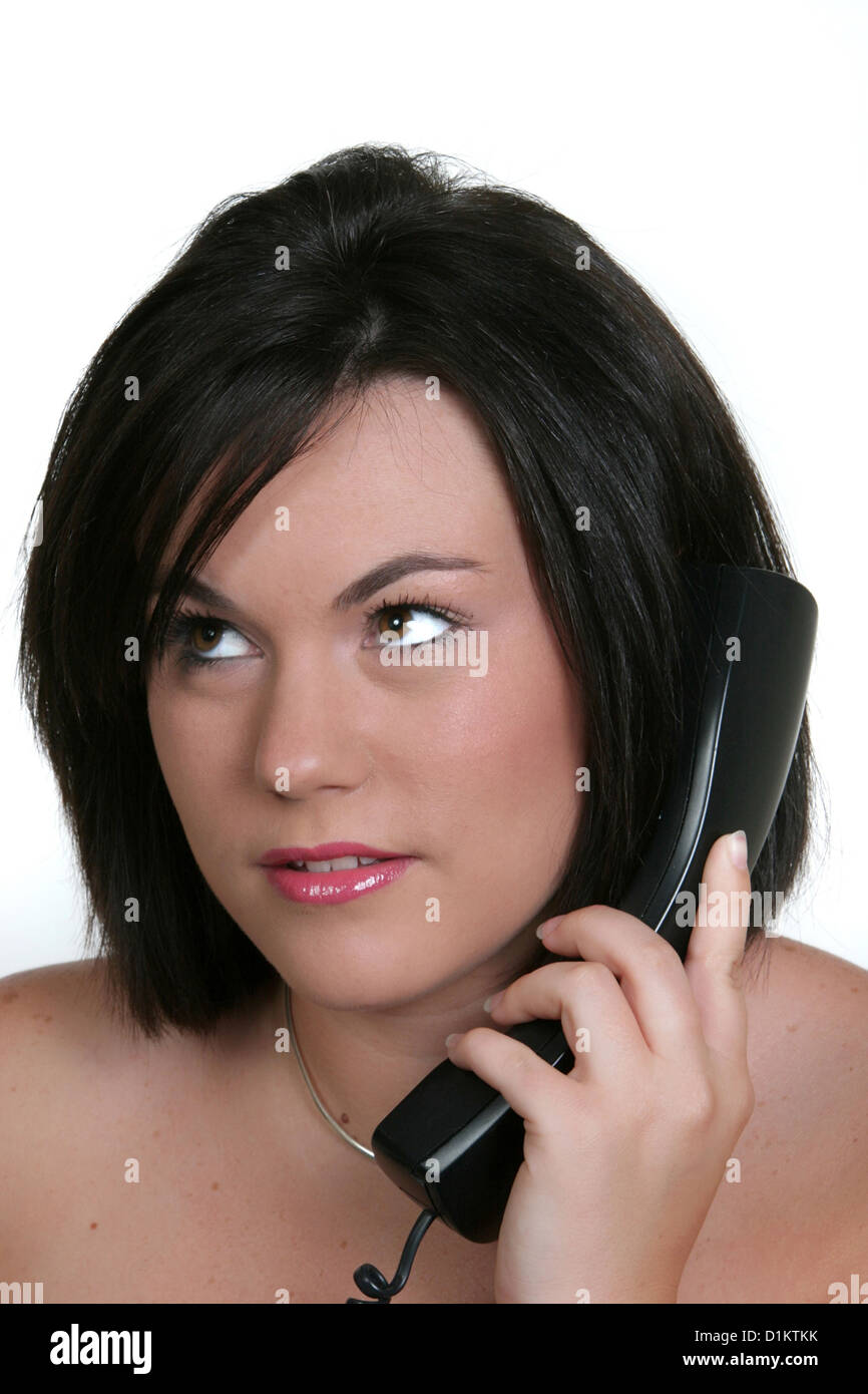 Woman rolling her eyes on the phone hires stock photography and images