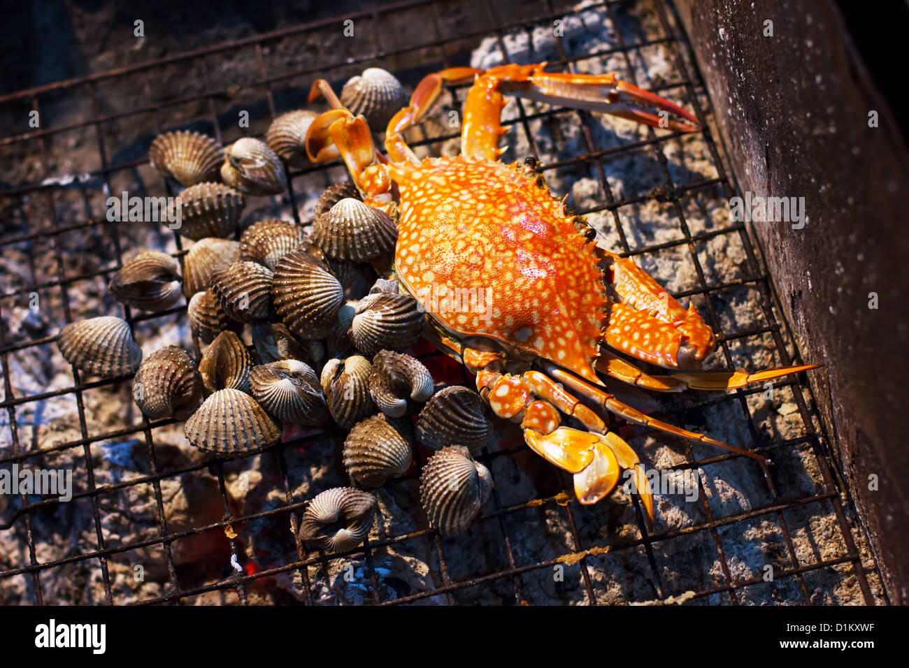 Seafood, crab and mussels (shellfish), grilled on charcoal Stock Photo ...