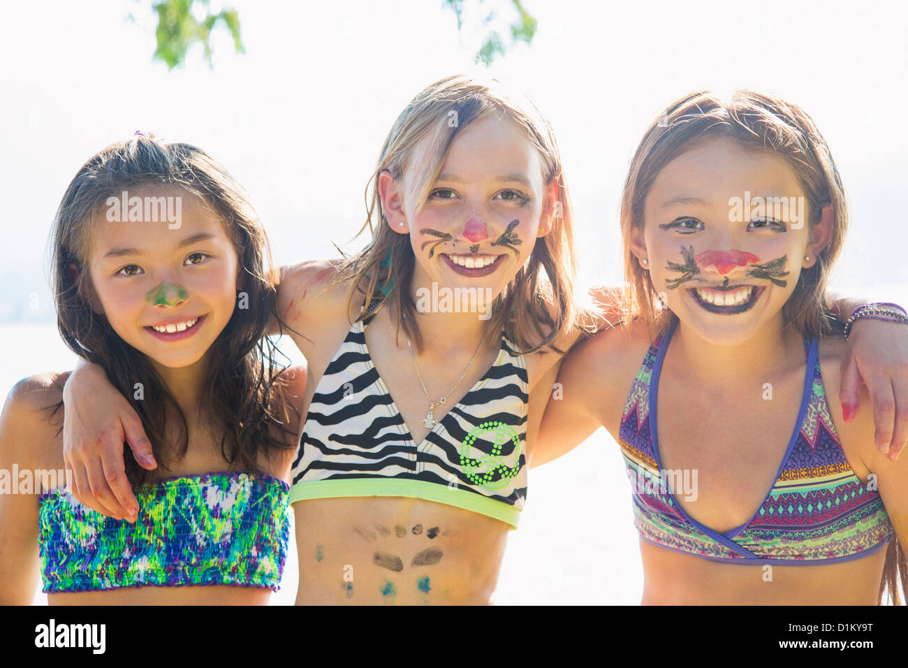 Smiling friends in face paint Stock Photo