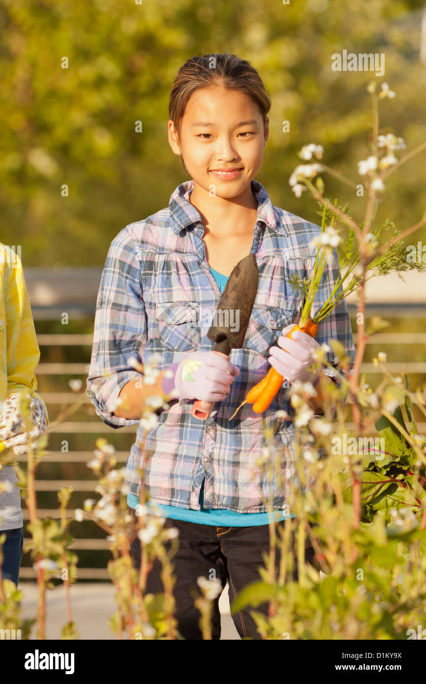 Japanese girl holding gardening trowel Stock Photo