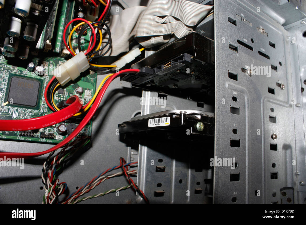 A desktop computer PC with opened cabinet showing the internal parts Stock Photo