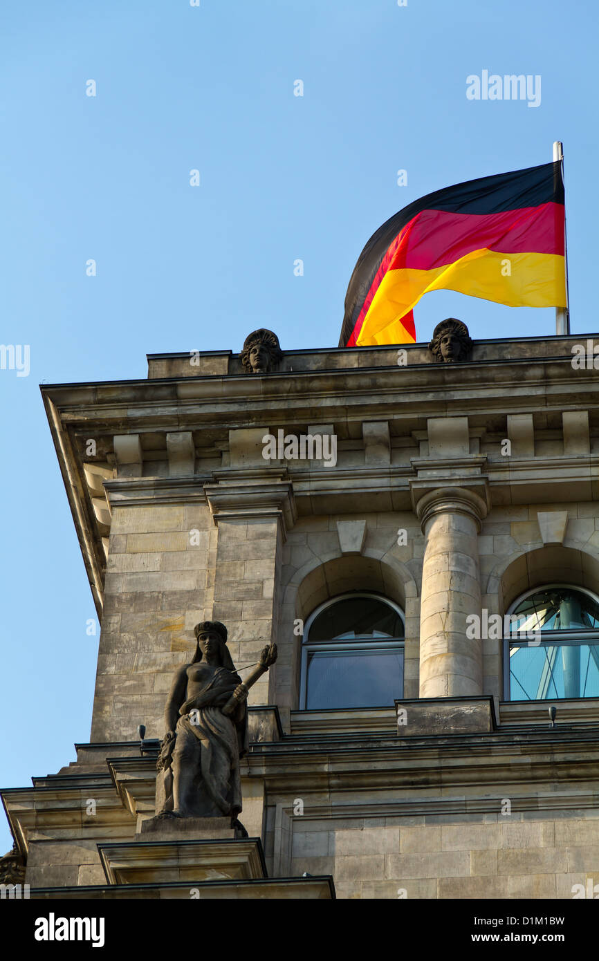 The German Flag waving from the Reichstag in Berlin, Germany Stock Photo