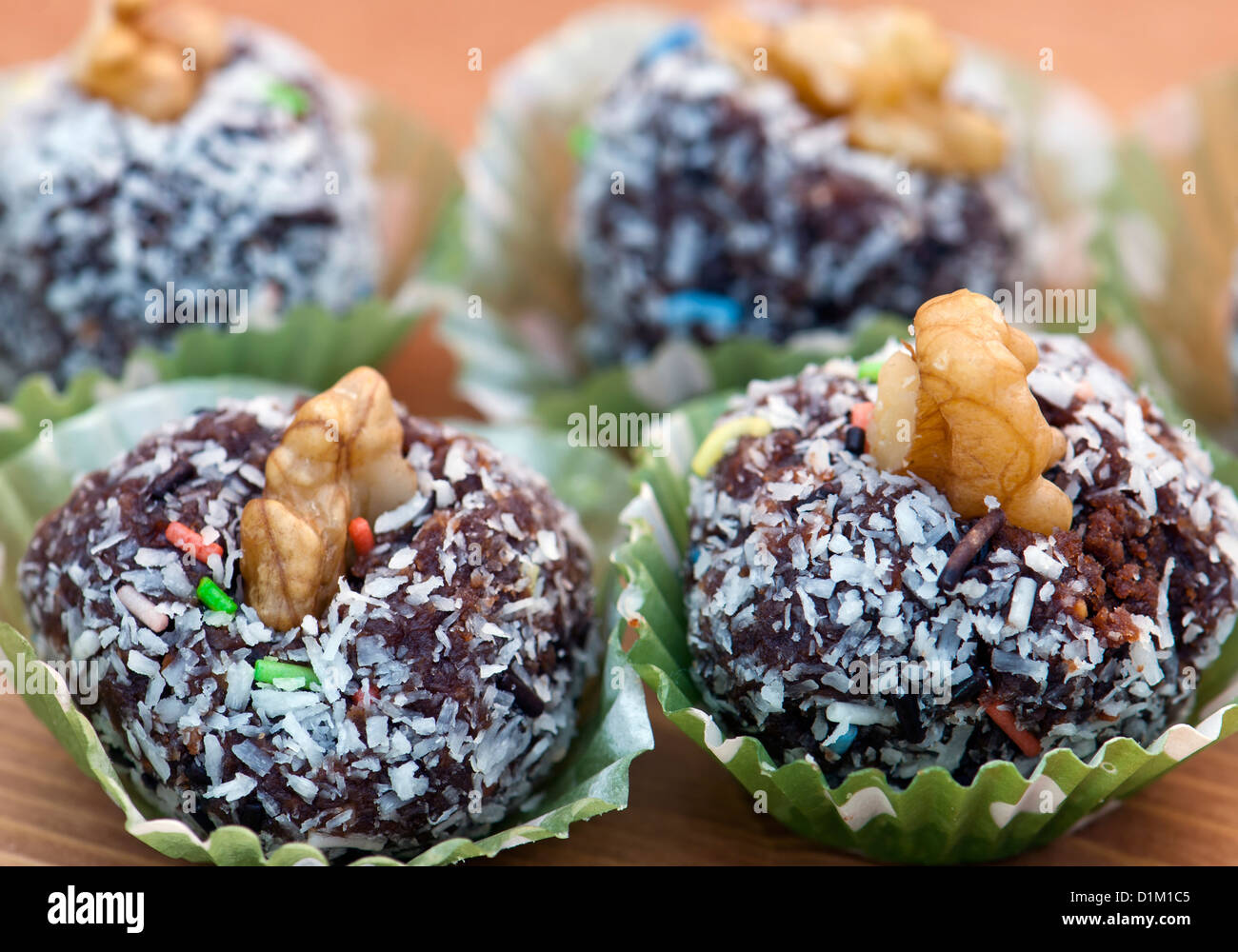 Rum balls in coconut and walnut Stock Photo Alamy