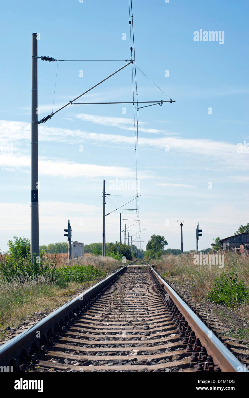 Electrified railway line running across a landscape Stock Photo Alamy