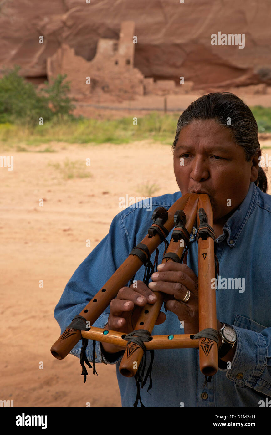 Travis Terry playing flute in his native Canyon de Chelly National Monument, Arizona, USA Stock Photo