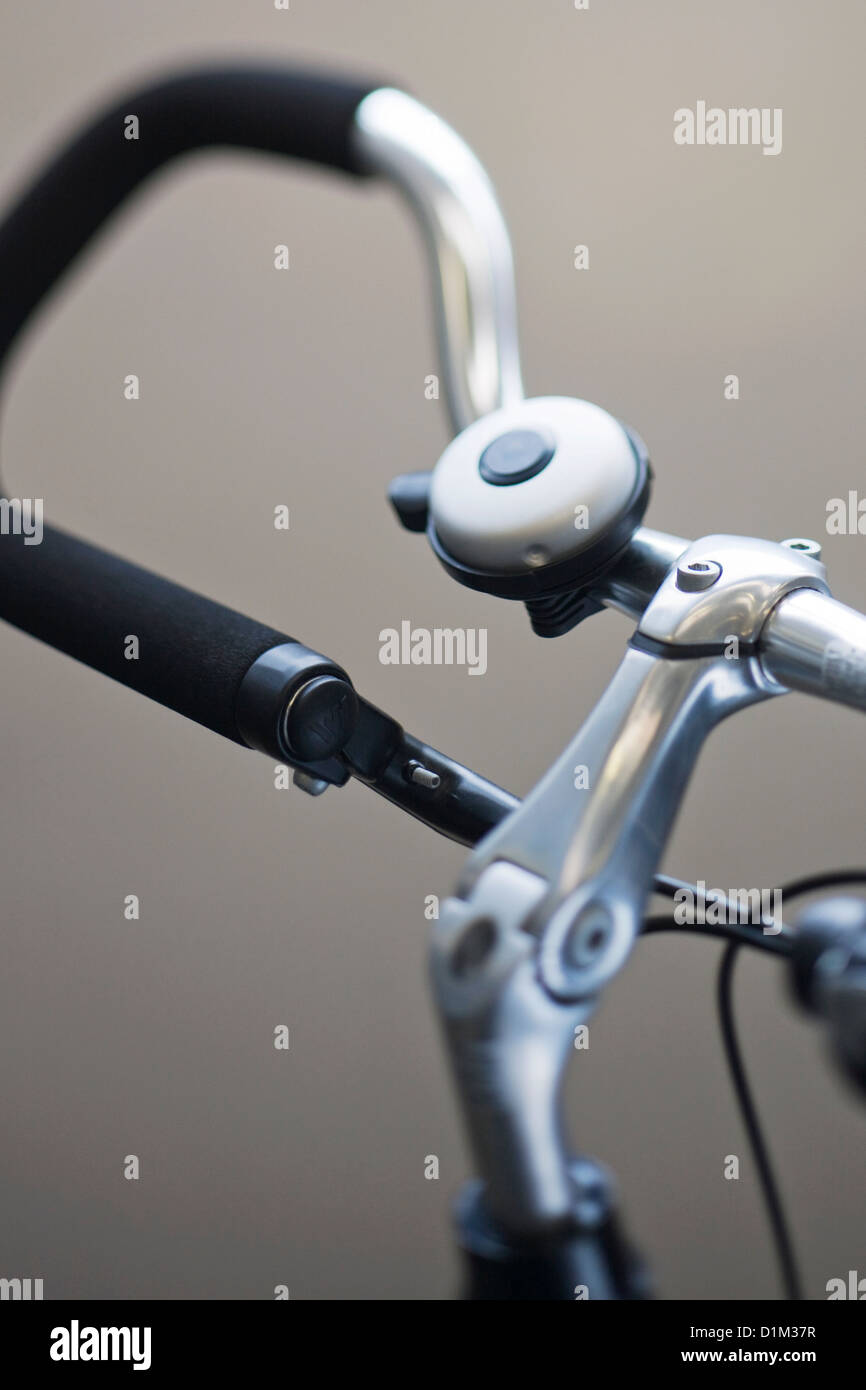 Close up of bike bell mounted on trekking bars part of bicycle