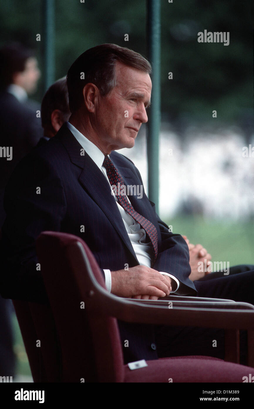 President George H.W. Bush listens to a speech during the retirement ceremony for Admiral William J. Crowe Jr., chairman, Joint Stock Photo