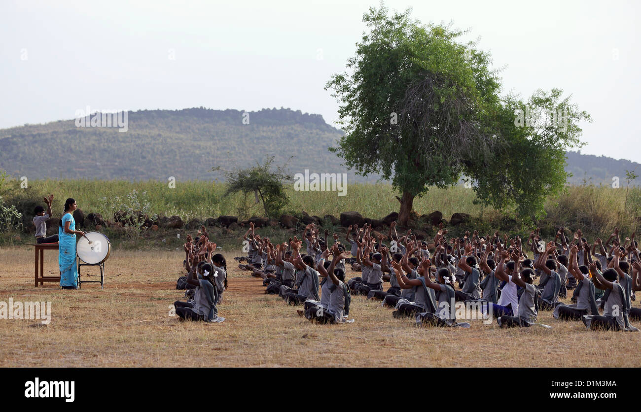 School children singing and clapping hands Andhra Pradesh South India Stock Photo