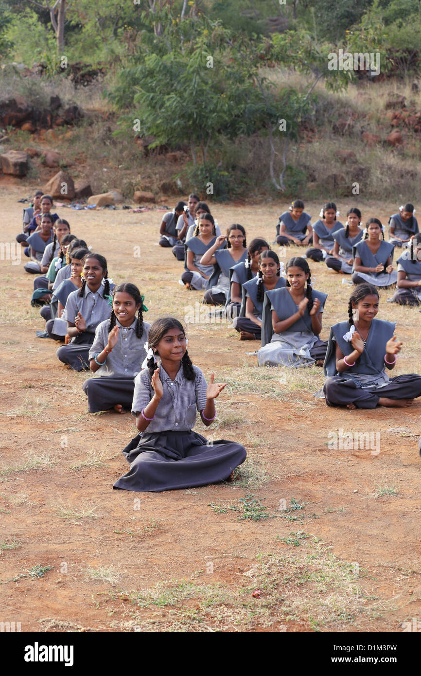 School children singing and clapping hands Andhra Pradesh South India Stock Photo
