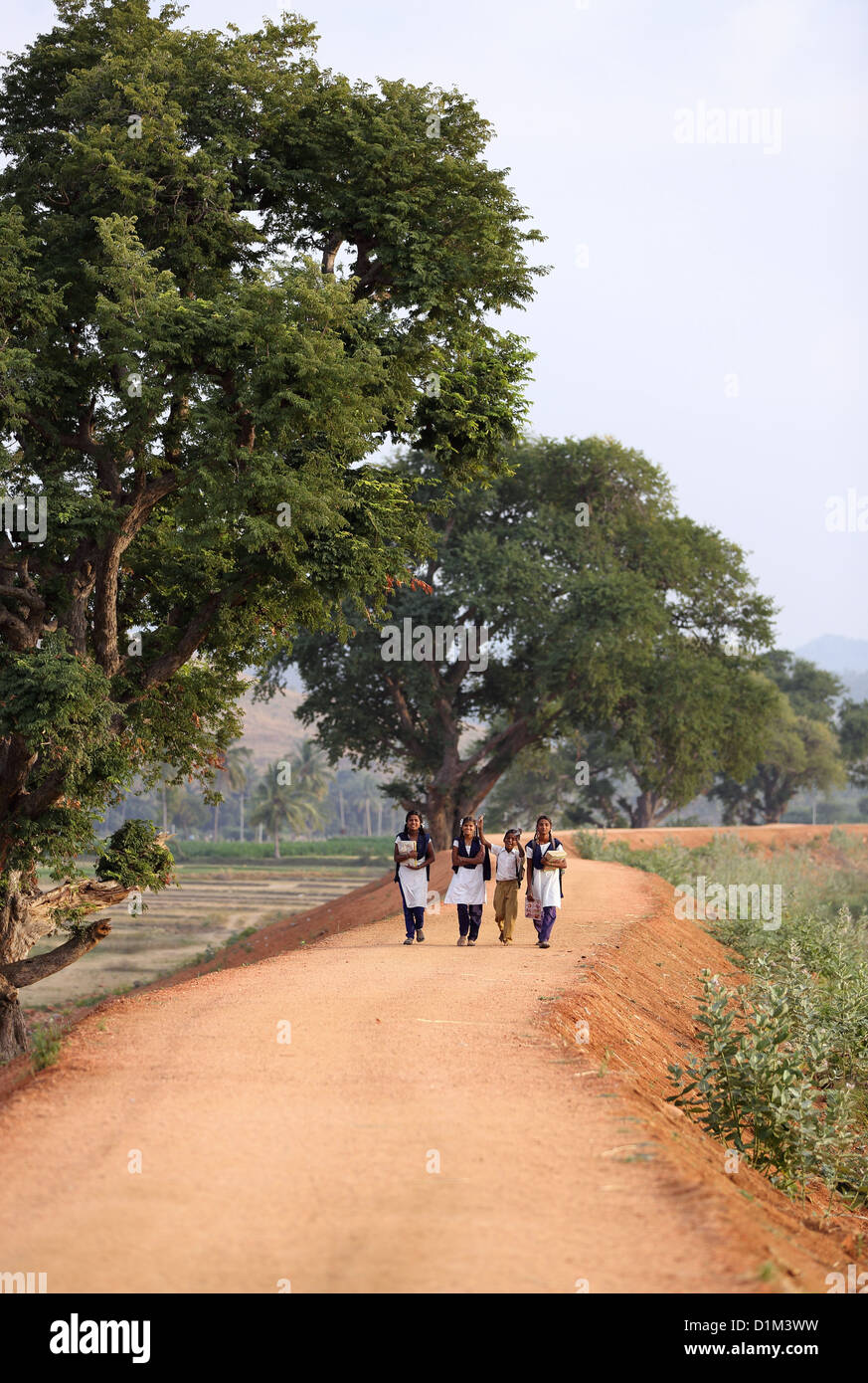 School children walking home Andhra Pradesh South India Stock Photo