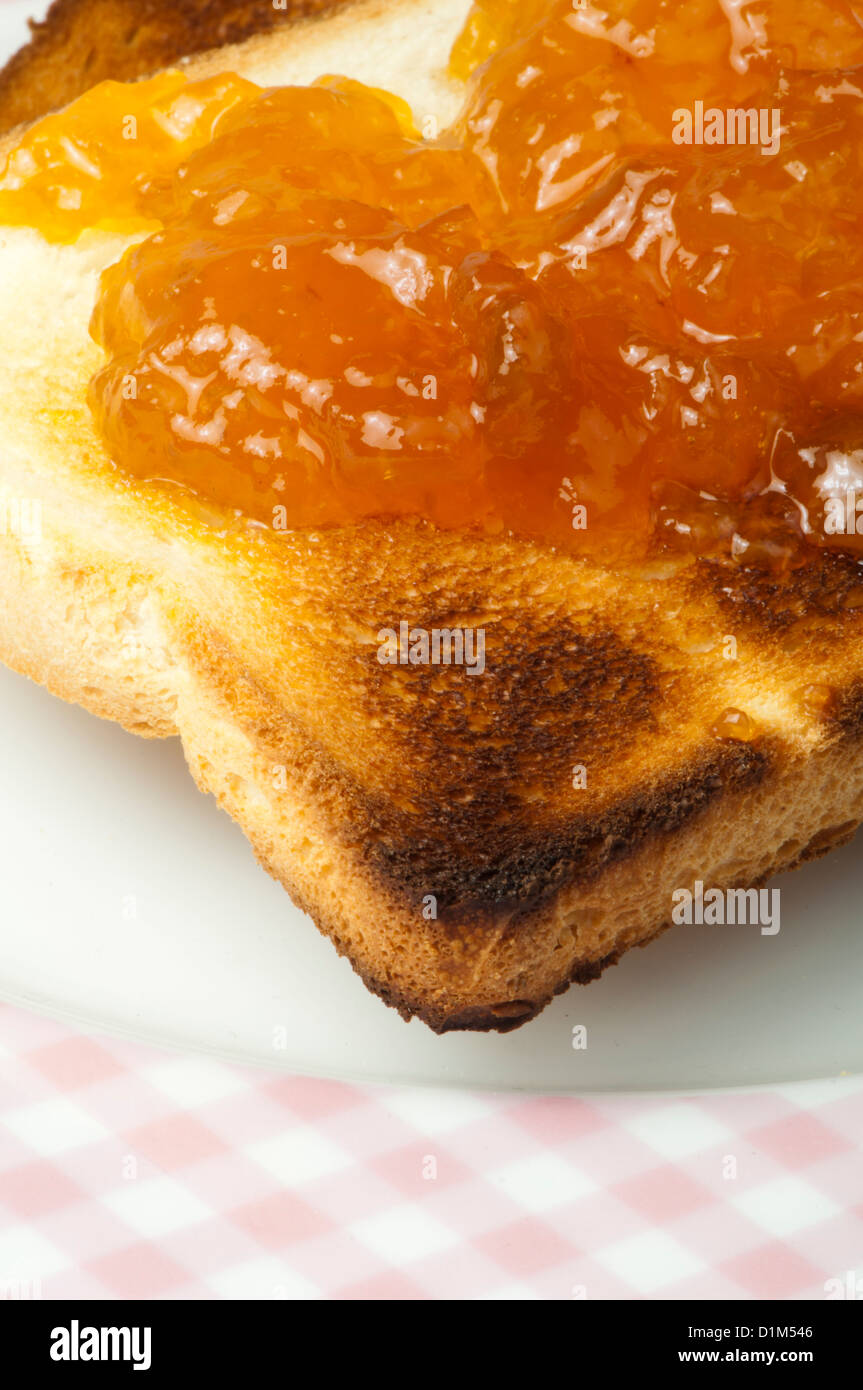 Spread jam on bread Stock Photo Alamy