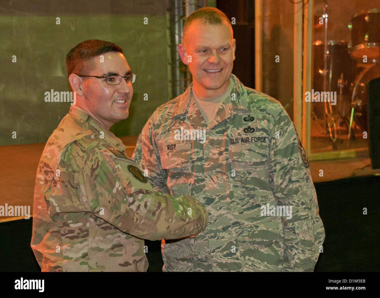 Chief Master Sergeant of the Air Force James A. Roy shakes hands with an airman assigned to NATO Training Mission-Afghanistan at Camp Eggers, Kabul, during an Airmen’s Call on camp Dec. 28. ( Credit Image: © airforce army navy news / Alamy) Stock Photo