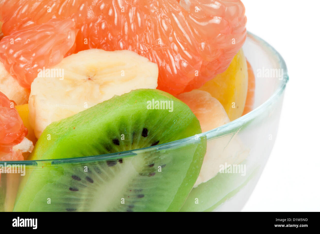 Fruit salad with citrus in a glass bowl on a white background Stock ...