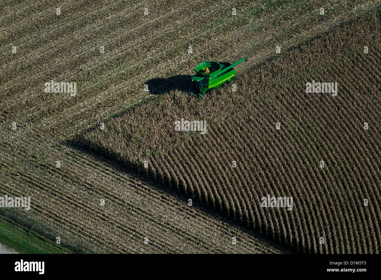 aerial photograph John Deere combine harvesting corn Iowa Stock Photo