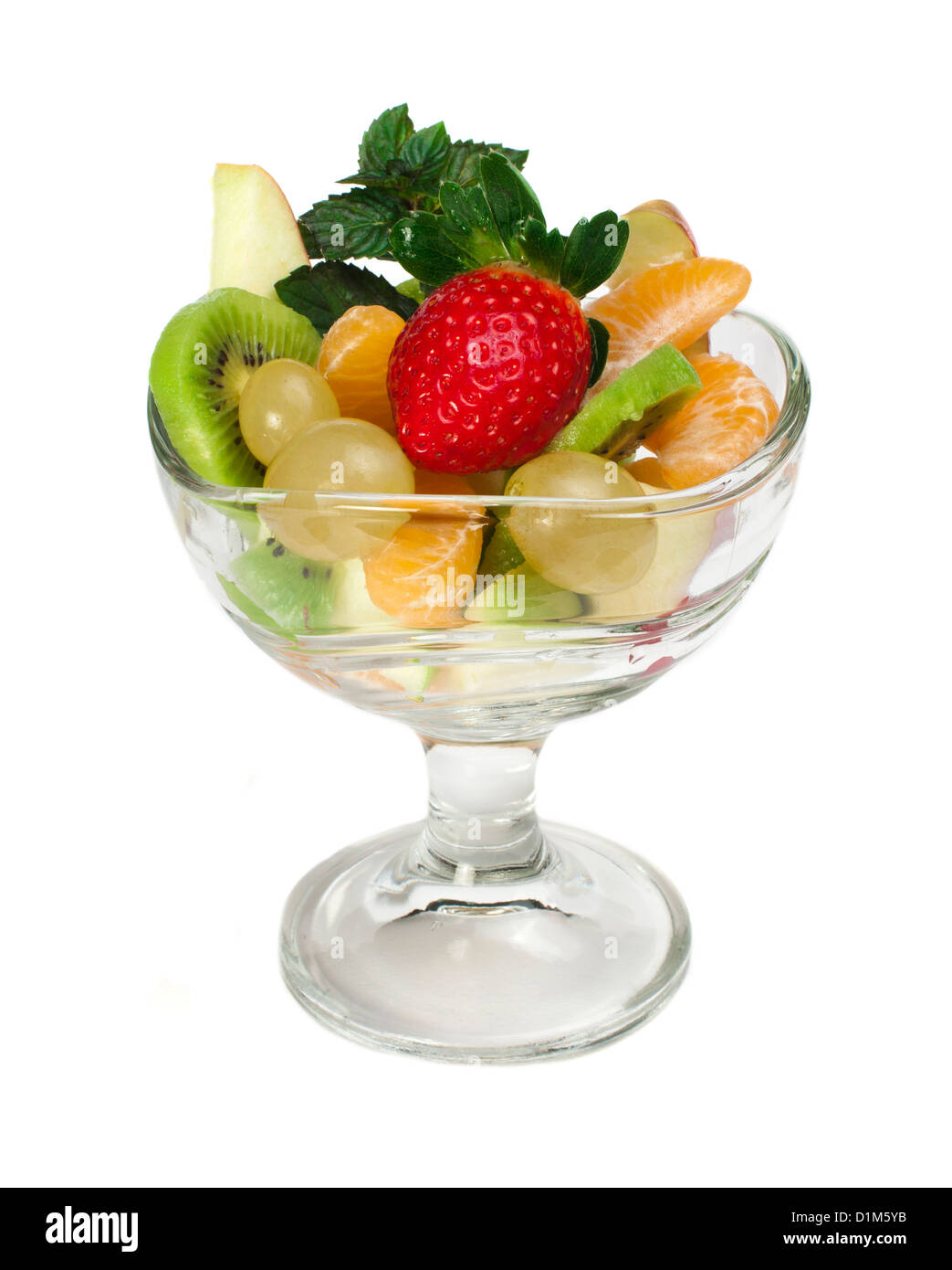 Fruit salad in a glass bowl on white background Stock Photo - Alamy