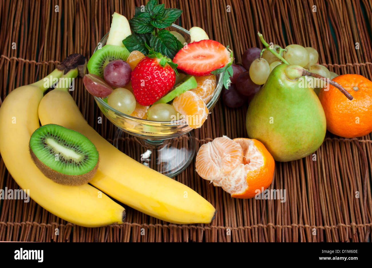 Fruit salad in a glass bowl and fruits Stock Photo - Alamy