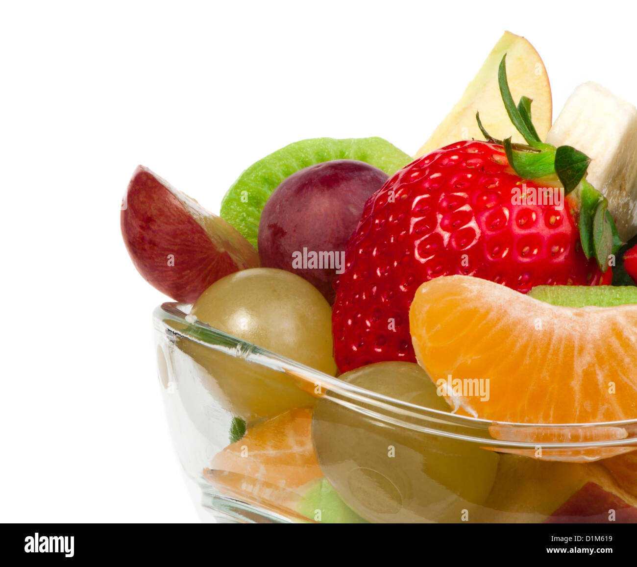 Fruit salad in a glass bowl on white background Stock Photo - Alamy