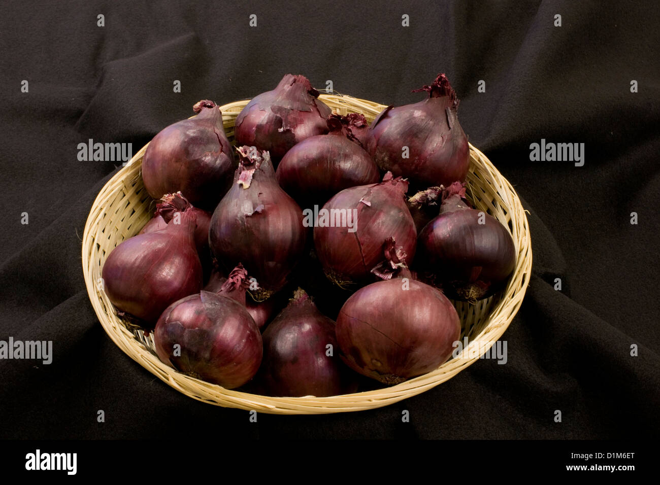 Basket of Red Onions Stock Photo