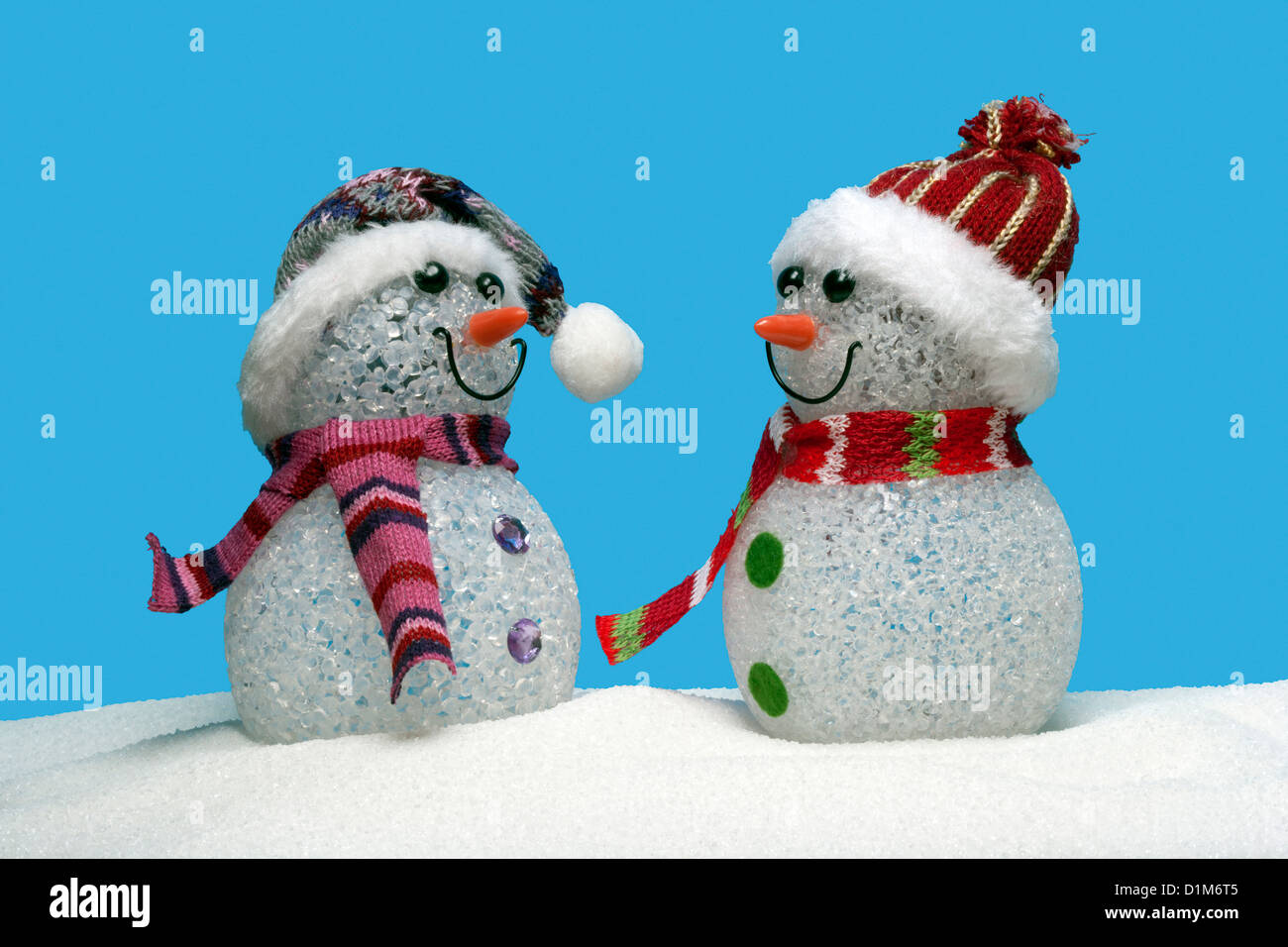 Two Snowmen and blue sky Stock Photo - Alamy