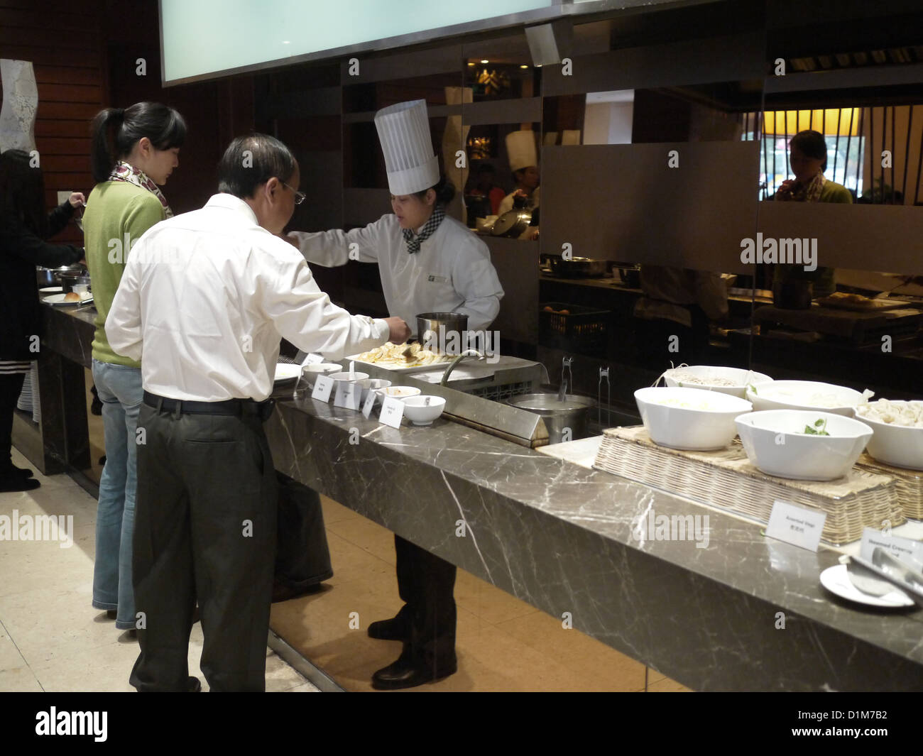 chinese hotel buffet chef  patrons Stock Photo