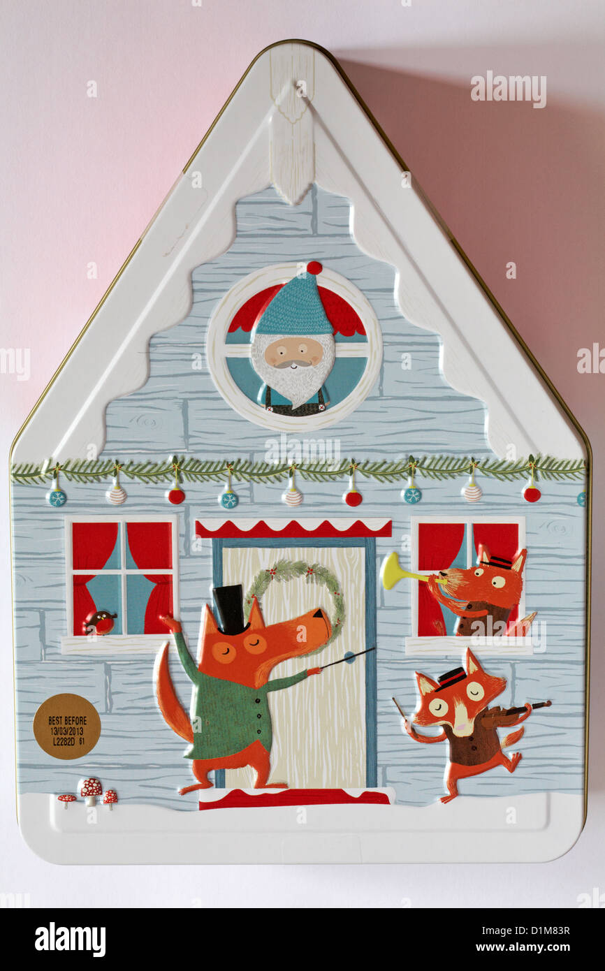 Decorative biscuit tin in shape of house isolated on white background