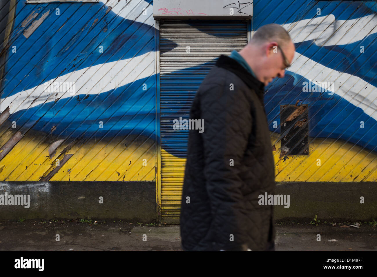 Scottish Saltire flag painted on the exterior wall of a pub in Govanhill, Glasgow, Scotland. Stock Photo