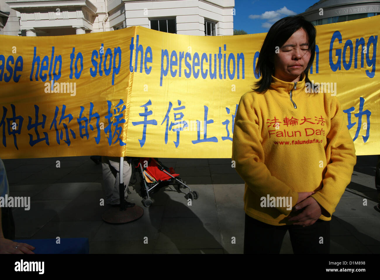 Falun Gong practitioner at a protest against persecution of Falung Gong (Falung Dafa) in China Stock Photo