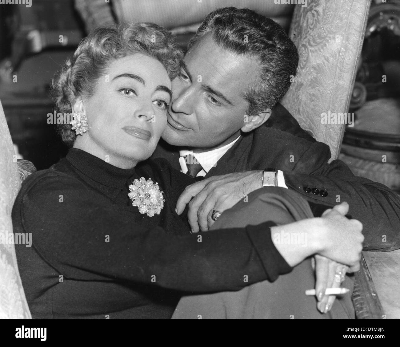 JOAN CRAWFORD (1905-1977) US film actress in 1957 making The Story of Esther Costello with Rossano Brazzi Stock Photo