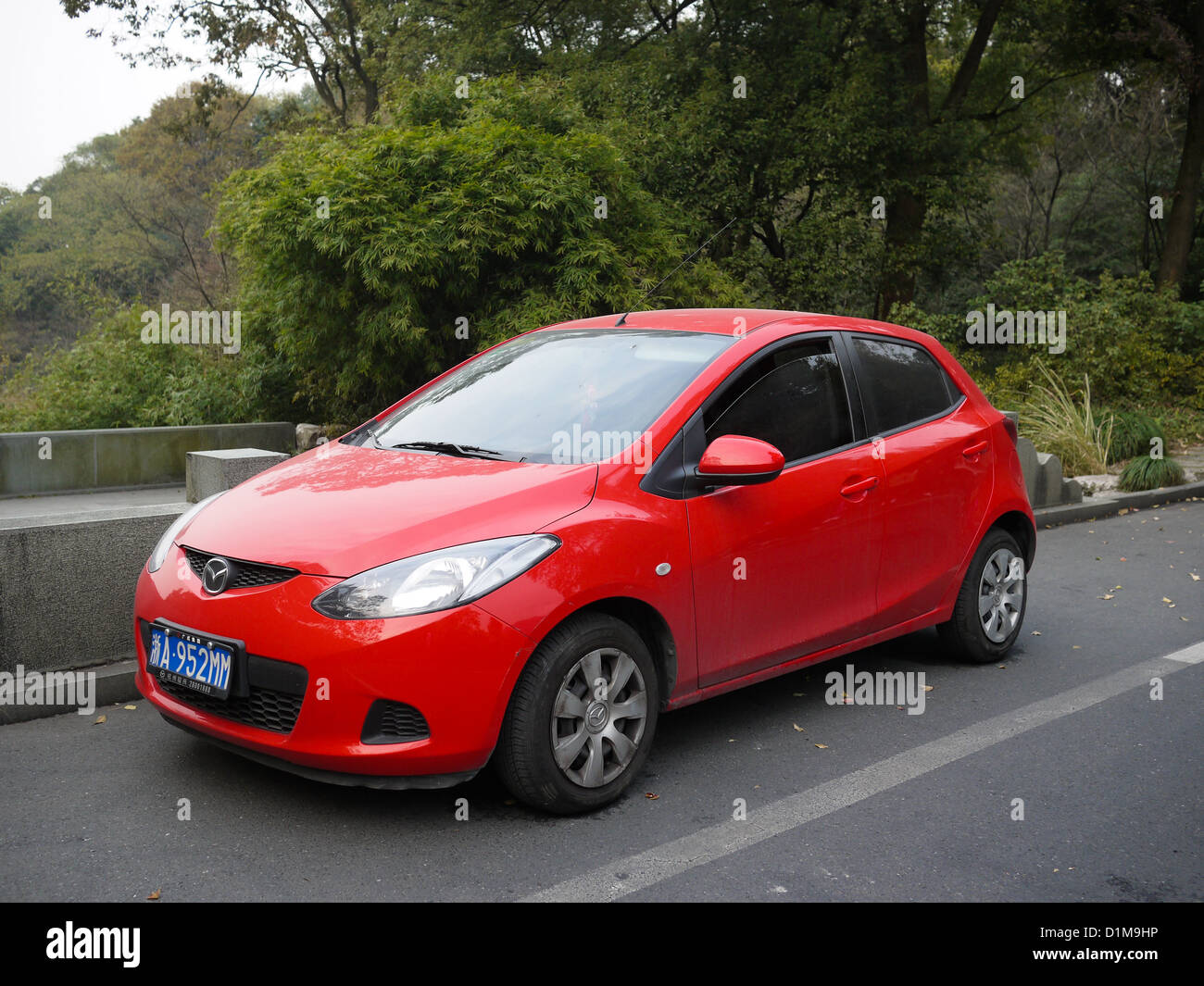red mazda two 2 compact car China Stock Photo