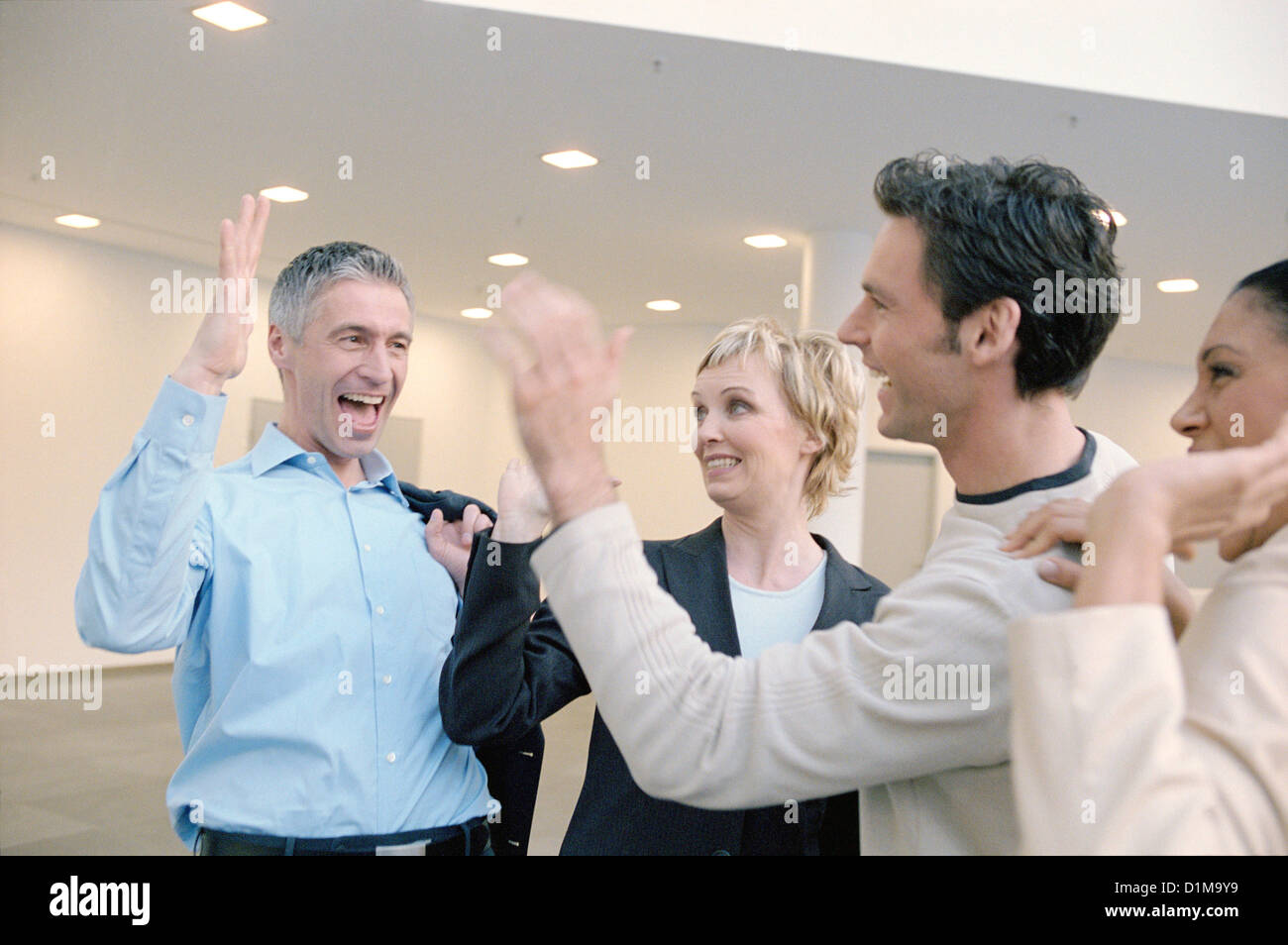 Two business people to give so a high five  License free except ads and billboards Stock Photo