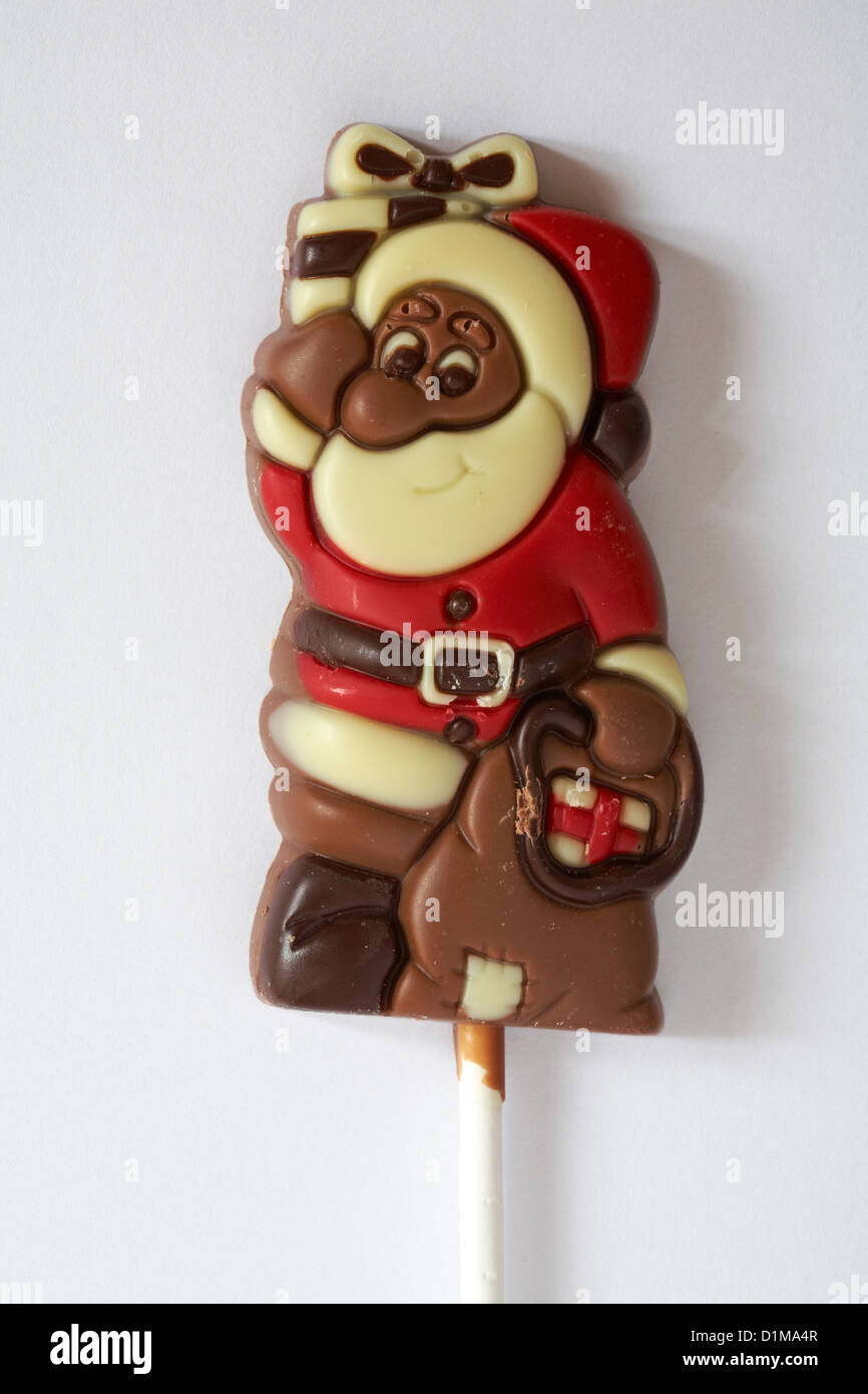Father Christmas Santa Claus chocolate lolly ready for Christmas on white background Stock Photo