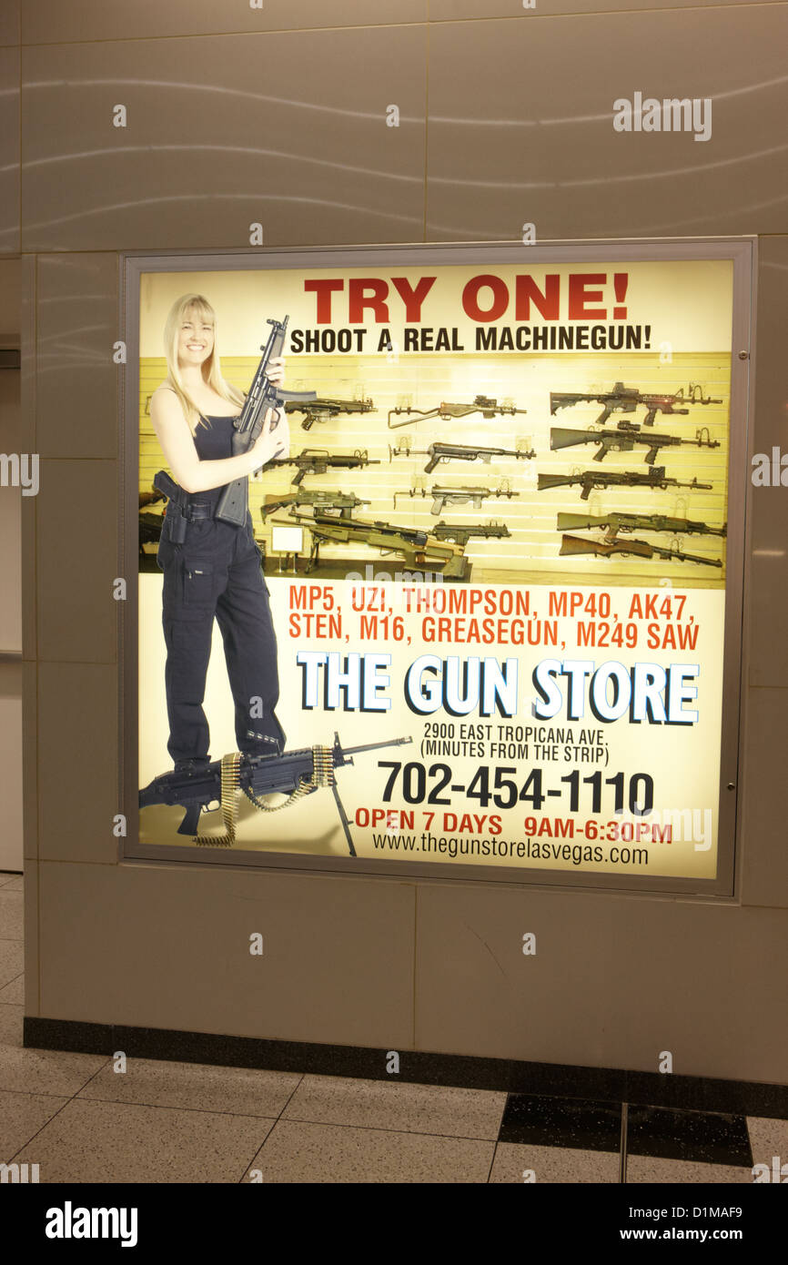 advert for a gun range store in mccarran airport Las Vegas Nevada USA Stock Photo