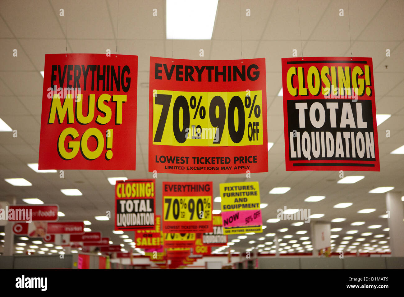 everything must go total liquidation closing signs in a store in Saskatoon saskatchewan canada Stock Photo