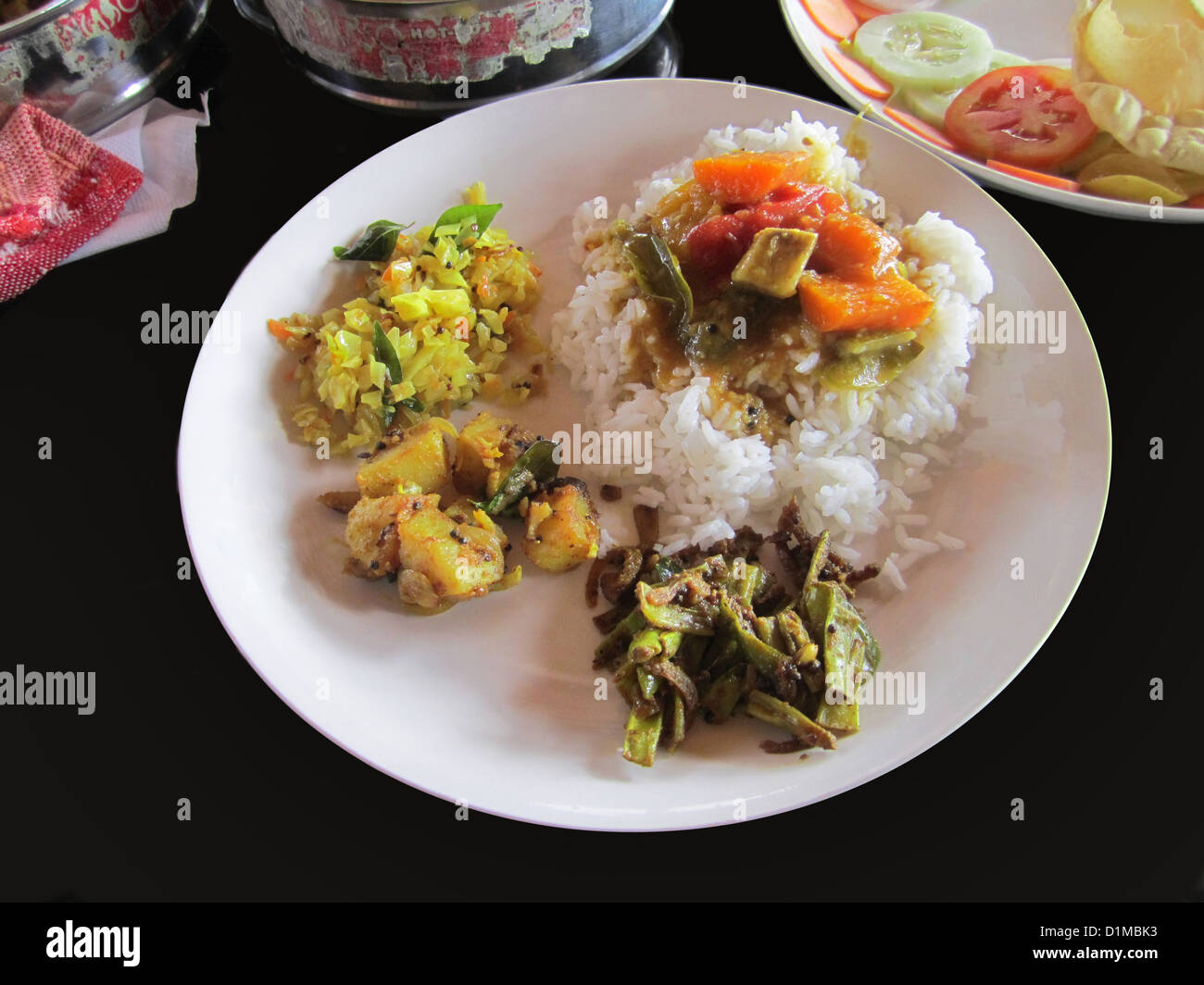 Traditional food of boiled rice and a host of sidedishes on houseboat
