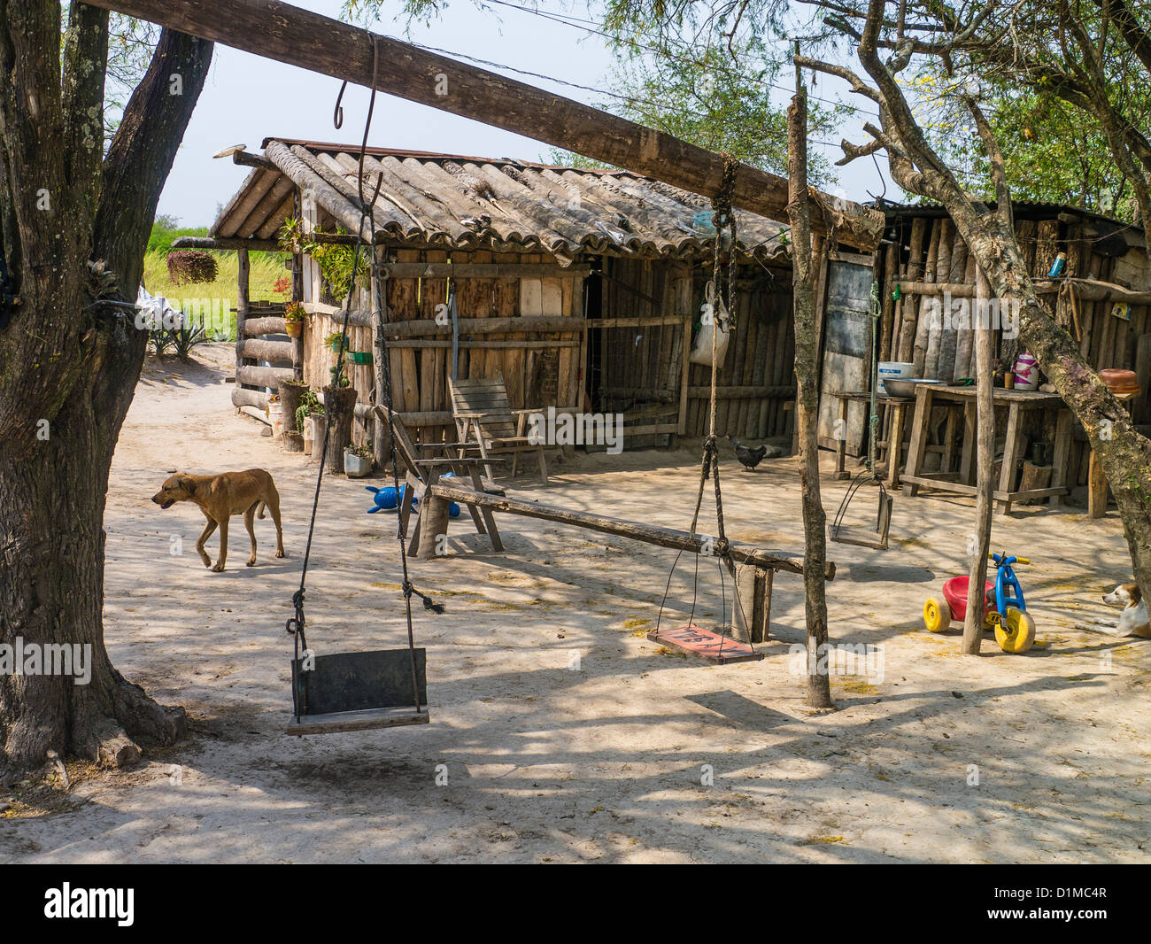 Primitive housing along highway nine in the Chaco region of northern Paraguay. Stock Photo