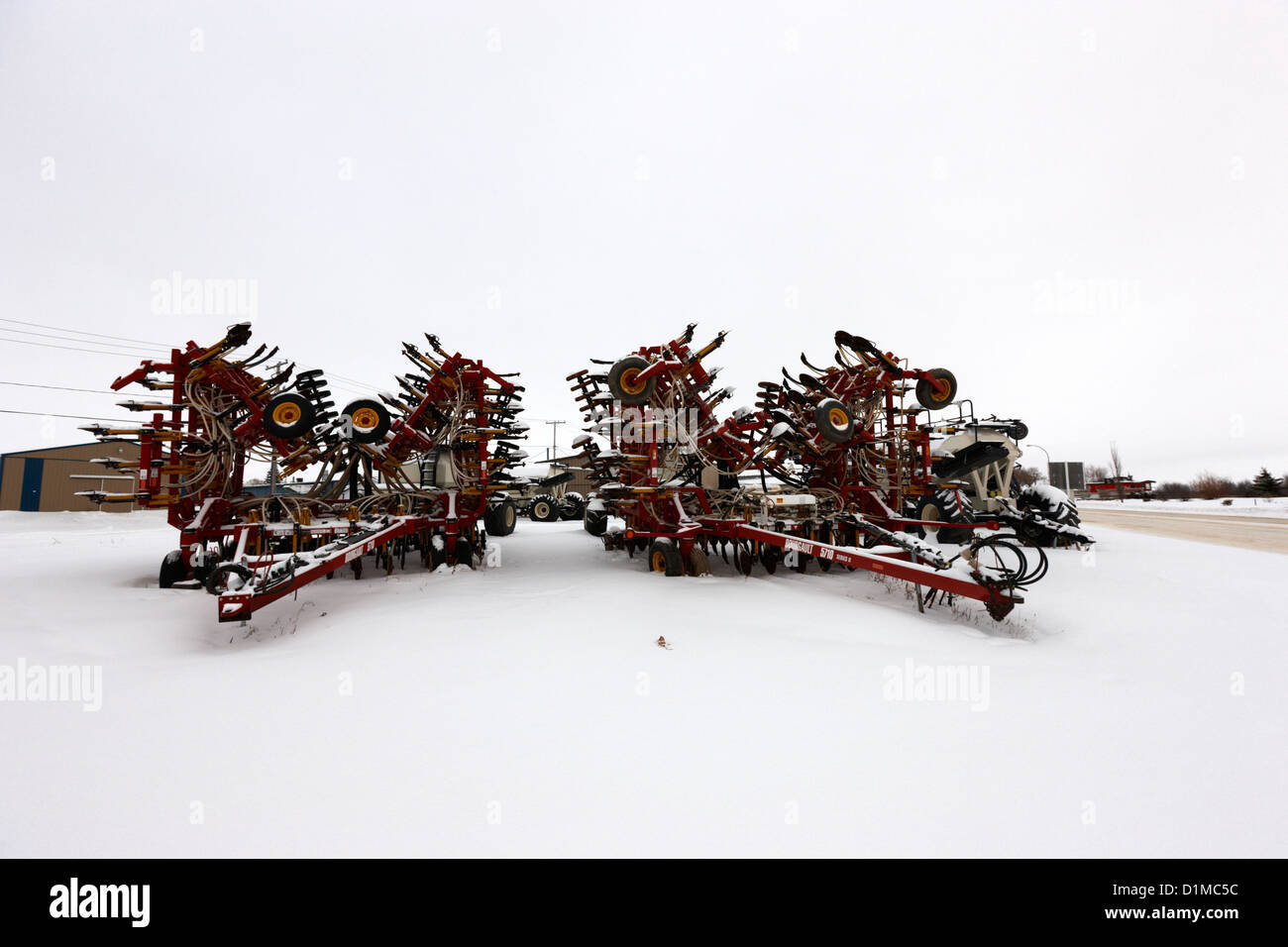 new bourgault 5710 air hoe drill covered in snow in winter Kamsack Saskatchewan Canada Stock Photo