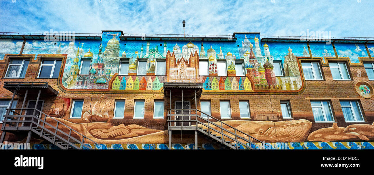 Colourful mural on building in the Russian coal mining town of Barentsburg in Svalbard Stock Photo