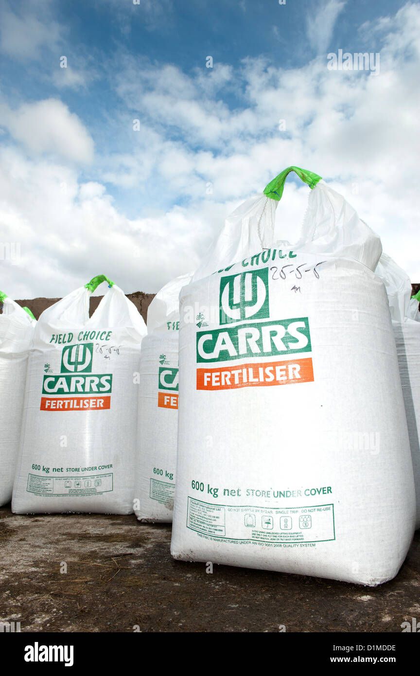 600kg Bags of fertiliser stored on farmyard, Cumbria, UK Stock Photo