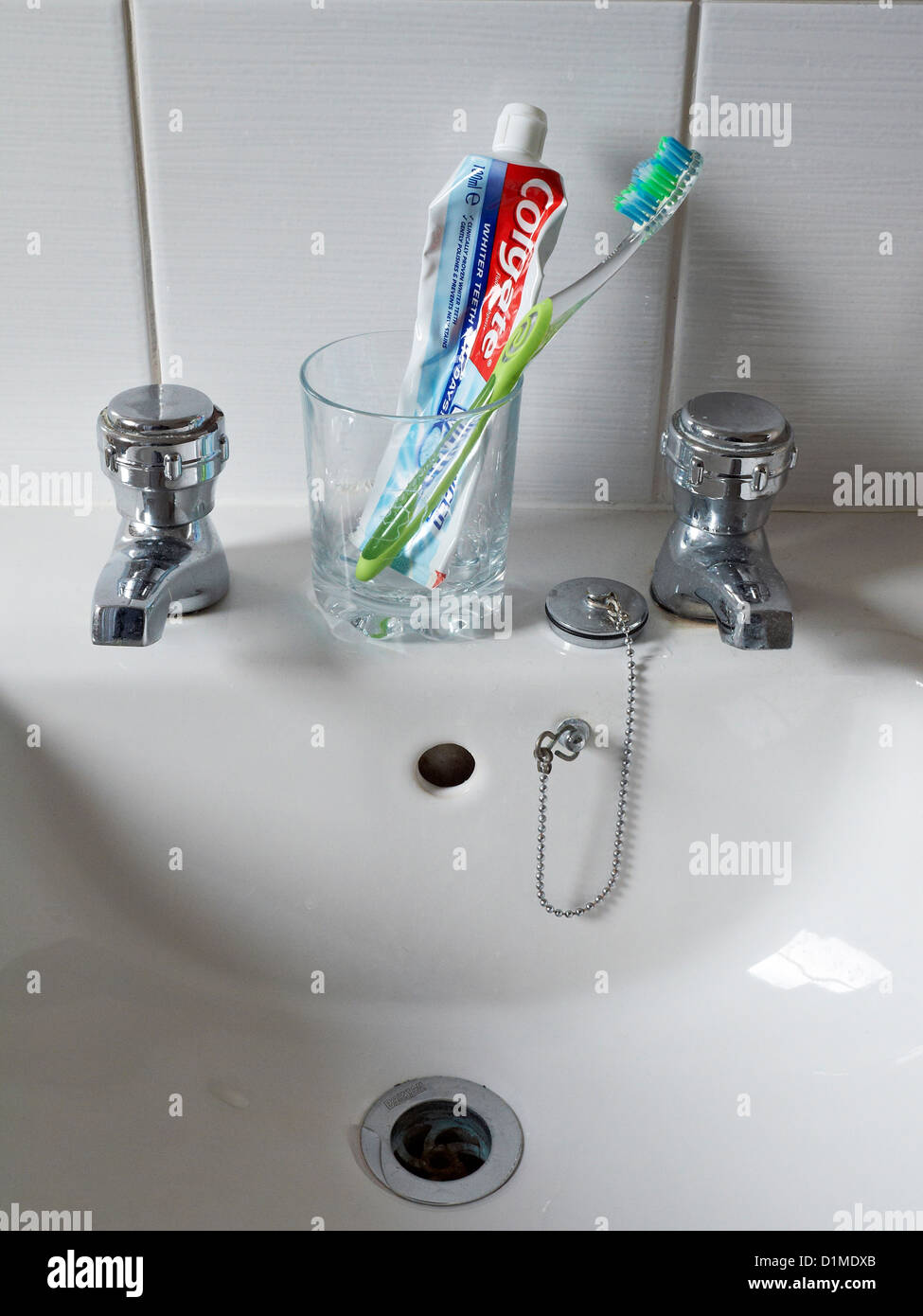 Washing sink with used colgate toothpaste and brushes Stock Photo Alamy