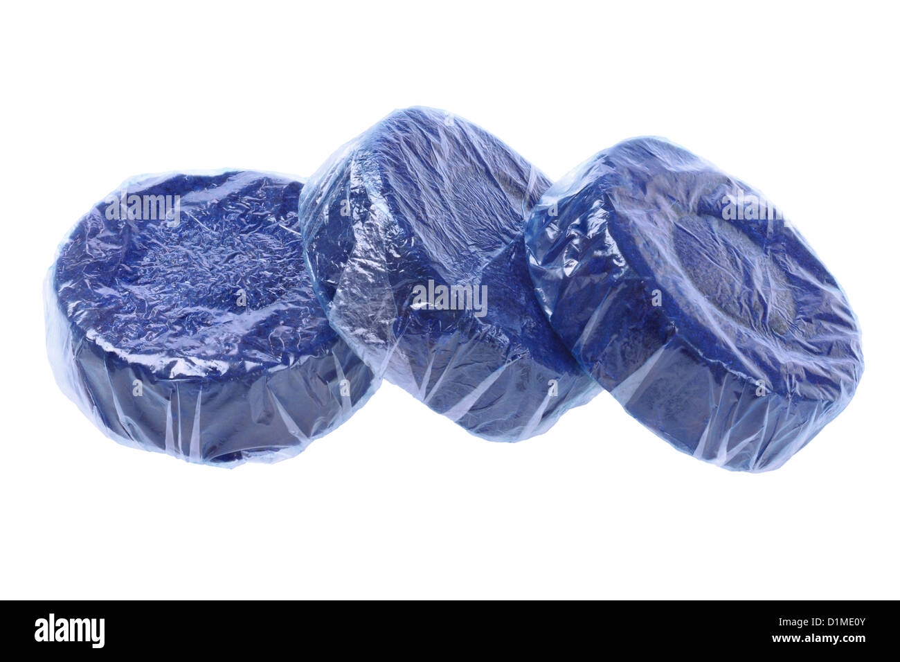 Three Tablets of Blue Toilet Bowl Cleaner on White Background Stock Photo