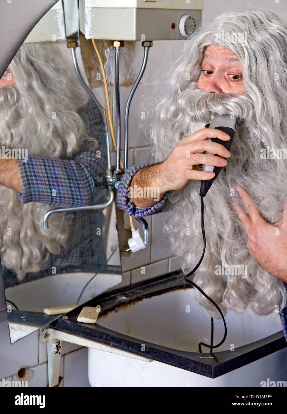 man adjusts his beard Stock Photo