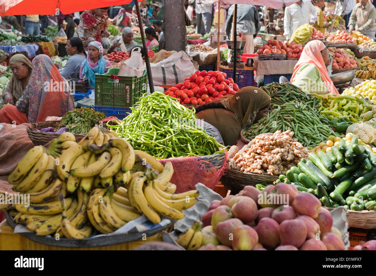 A colorful fruit and vegetable market in India with local Indian men