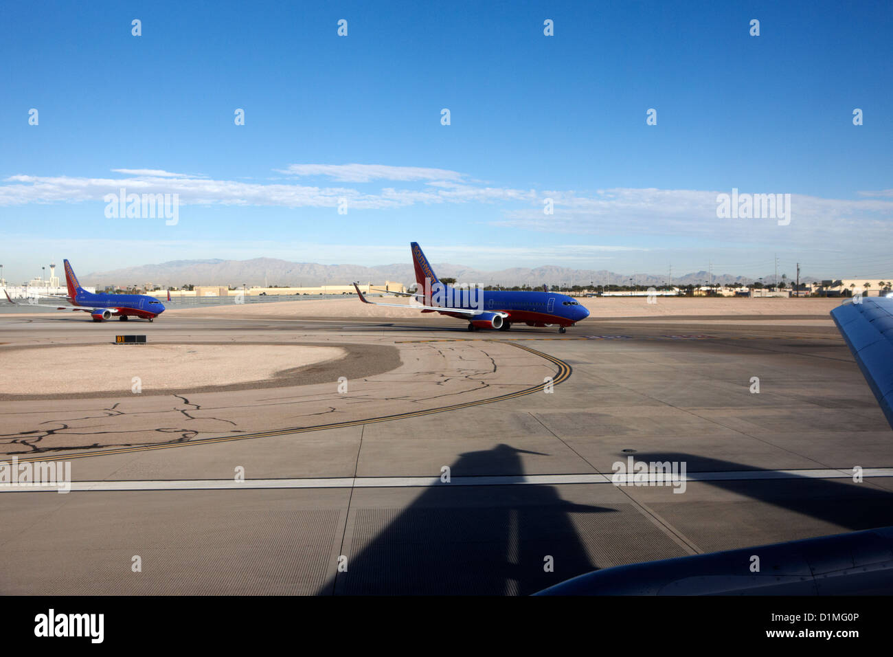 passenger jets waiting in line to take off at McCarran International airport Las Vegas Nevada USA Stock Photo