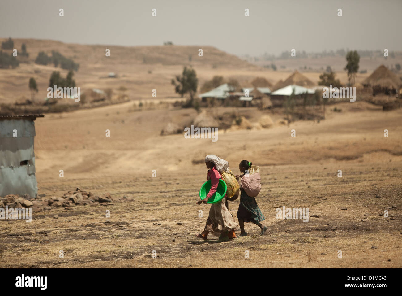 Villagers walk through rural eastern Ethiopia, Horn of Africa. Stock Photo
