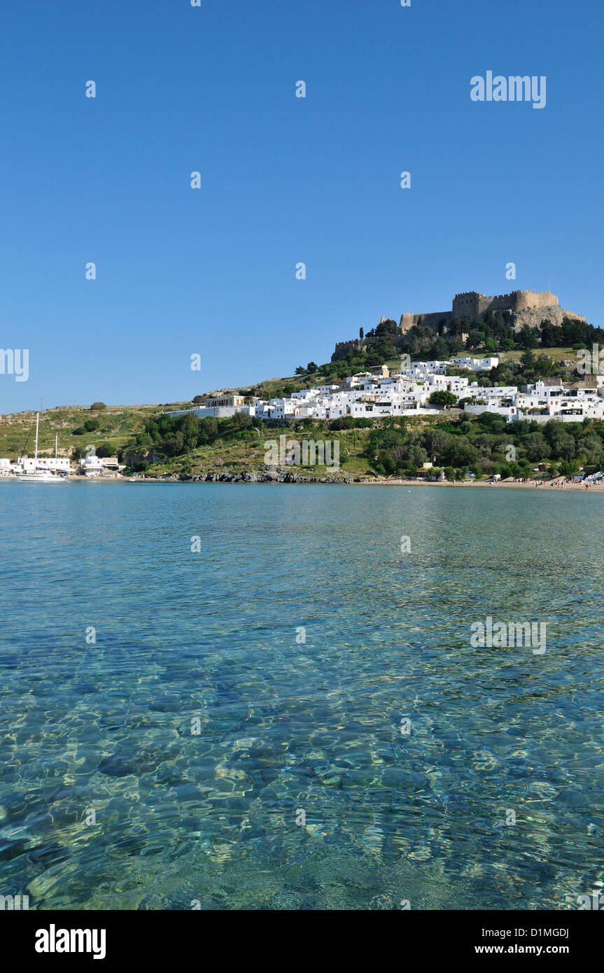 Lindos. Rhodes. Dodecanese Islands. Greece. View of the Acropolis & Lindos beach. Stock Photo