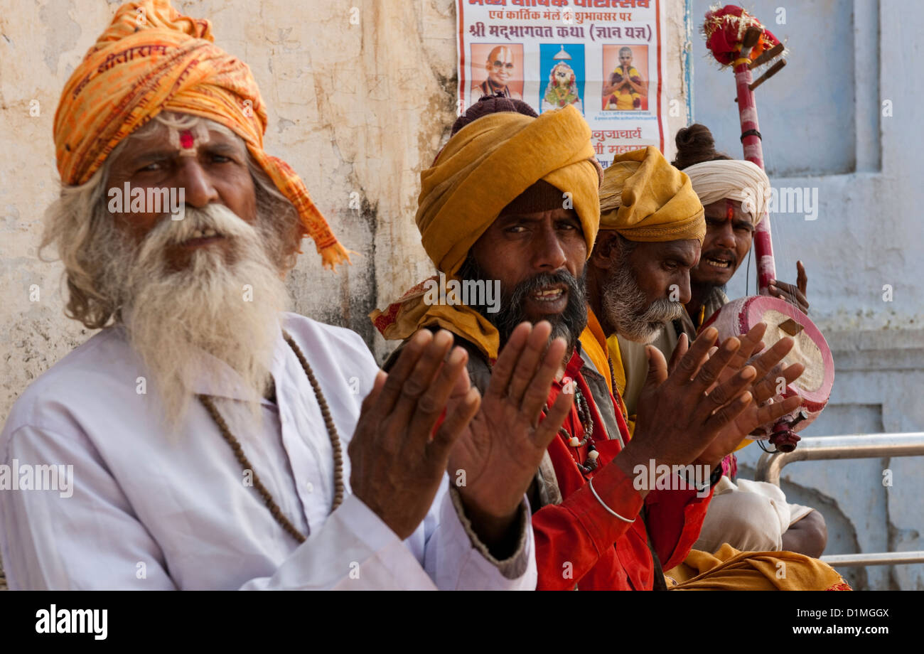 A colorful band of musicians perform on traditional instruments in traditional costumes in the holy city of Pushkar Rajasthan Stock Photo