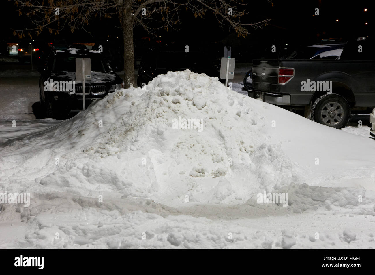 pile of snow stacked in parking lot Saskatoon Saskatchewan Canada Stock Photo